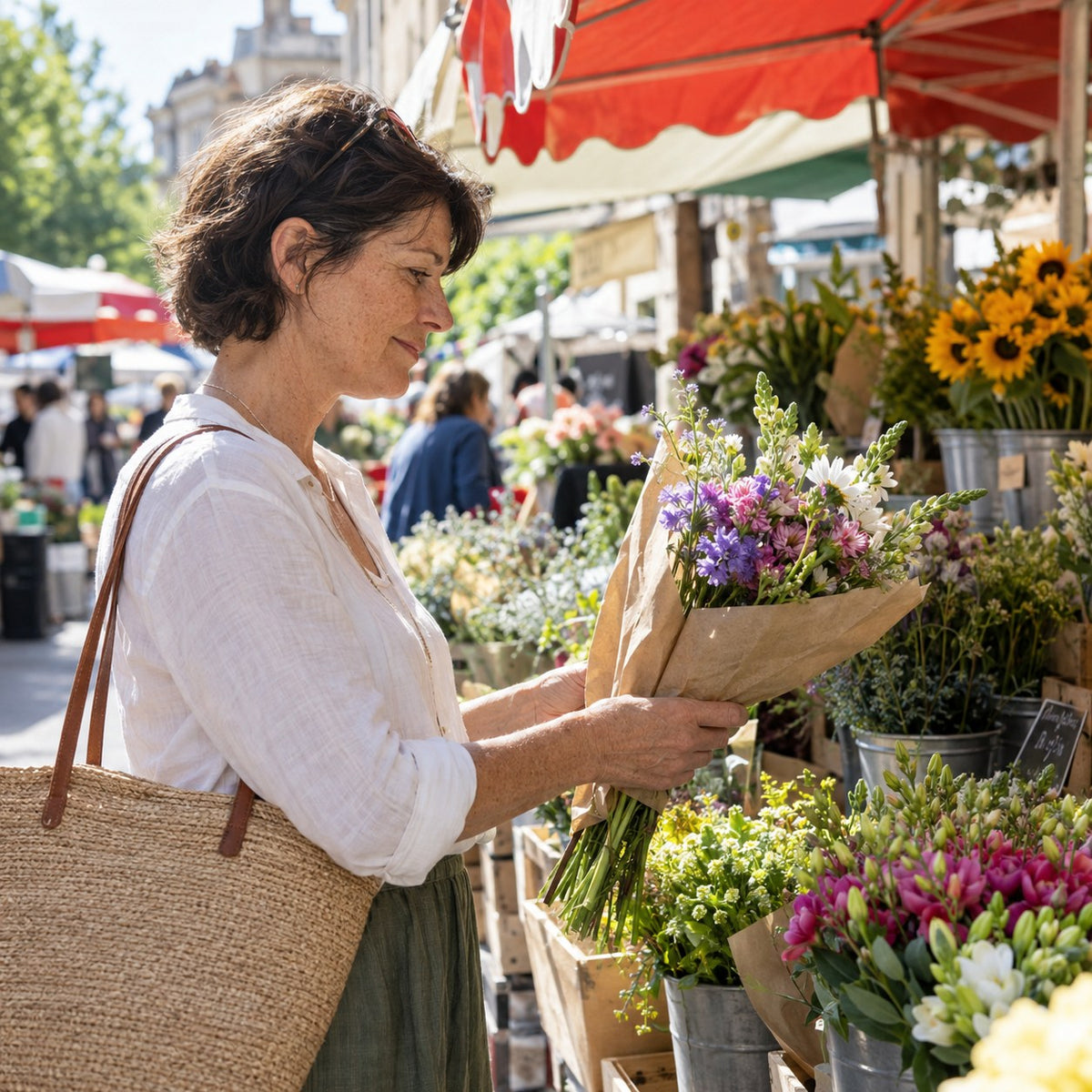 Woman choosing a bouquet at an outdoor flower market